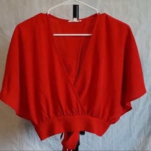 Red crop top, V-Neck with a tie wrap on the back